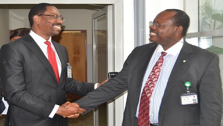 (L-r): Sullivan Akala, executive director, Business development, of eTranzact International Plc, discussing with Barr Chris Oyemenam, director-general and chief executive officer, National Identity Management Commission (NIMC) at e-payment for Government Summit 2014, held in Lagos…during the week.